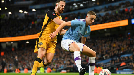 TAYLOR MADE: Taylor Harwood-Bellis shows his strength to hold off Port Vale striker Tom Pope