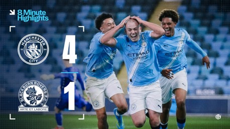 Scoreboard showing Manchester City 4, Blackburn Rovers 1. Manchester City players celebrating on the field. Logo of both clubs visible.