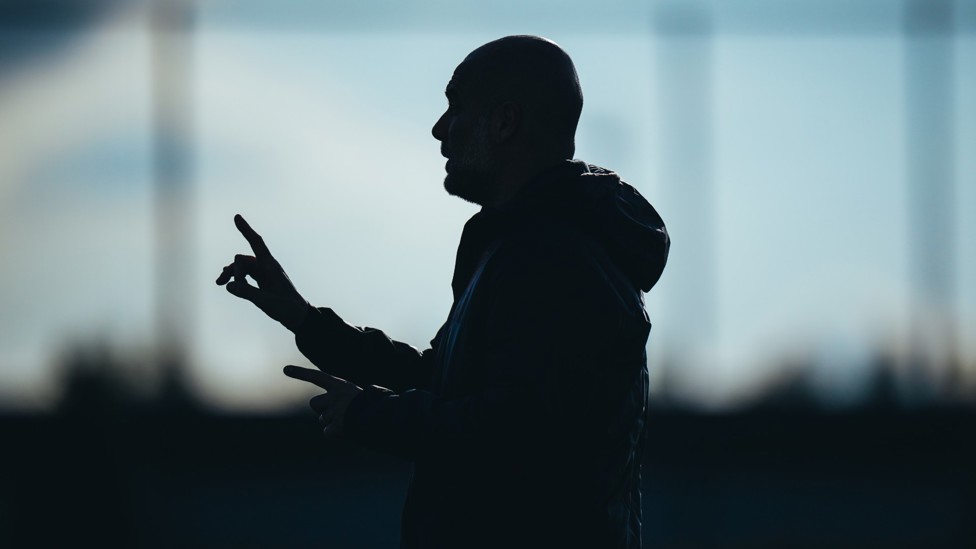SILHOUETTE : Pep Guardiola leads the session