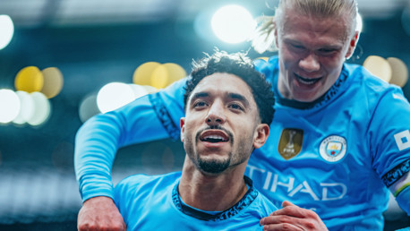 ALL SMILES: Haaland celebrates with Marmoush.