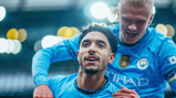 ALL SMILES: Haaland celebrates with Marmoush.