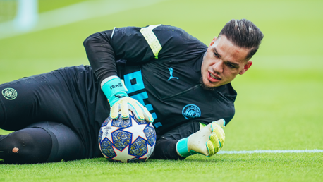 SAFE HANDS: Ederson gets a feel of the ball during the pre-match warm up.