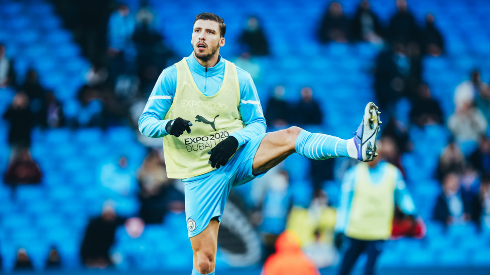 GET LOOSE : Dias goes through his stretches during the pre-match warm up.