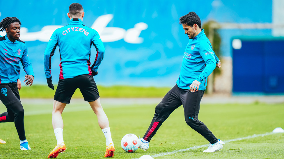 STEPPING INTO IT : Ilkay Gundogan takes control of the ball