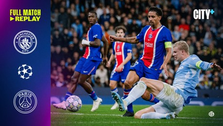 A soccer match between Manchester City and Paris Saint-Germain, featuring a slide tackle. Logos for both teams and the UEFA Champions League are visible. It mentions 'Full Match Replay' and 'City+' on the left side.