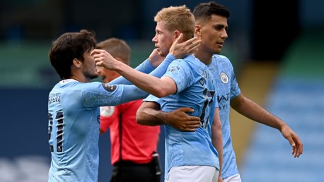 FEELING THE LOVE: Silva and Rodri congratulate KDB after his stunning goal.