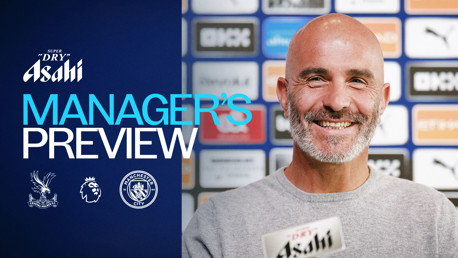 Banner featuring a smiling man in front of a backdrop of sponsor logos, with text indicating a Manager's Preview for a game between Crystal Palace and Manchester City.