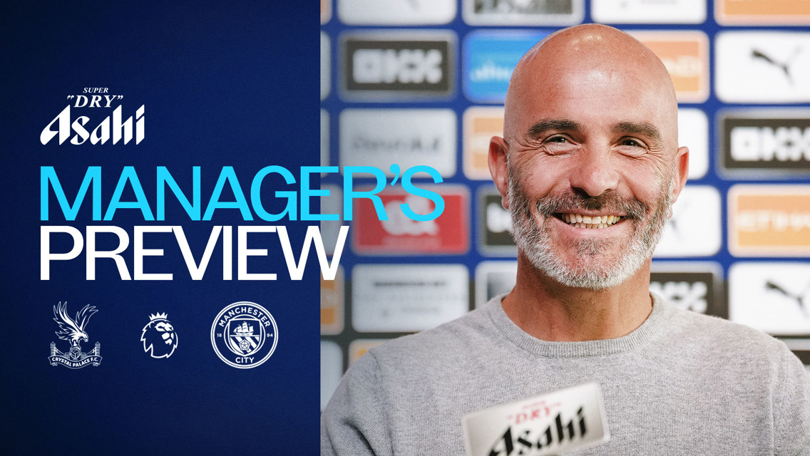 Banner featuring a smiling man in front of a backdrop of sponsor logos, with text indicating a Manager's Preview for a game between Crystal Palace and Manchester City.