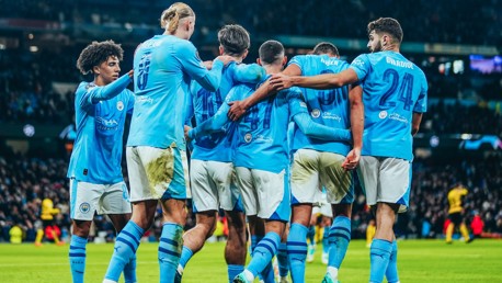 CENTRE OF ATTENTION: Foden feels the love after his goal.