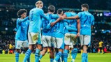 CENTRE OF ATTENTION: Foden feels the love after his goal.