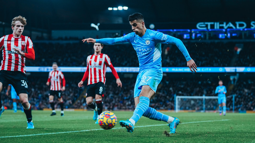 IN THE MIXER : Joao Cancelo launches a cross into a dangerous area
