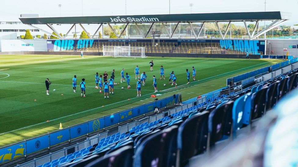 WIDE SHOT : The squad go through their workout
