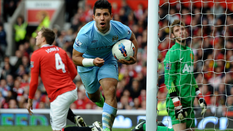 DEMOLITION DERBY : Kun wheels away in delight after netting at Old Trafford in THAT 6-1 victory!