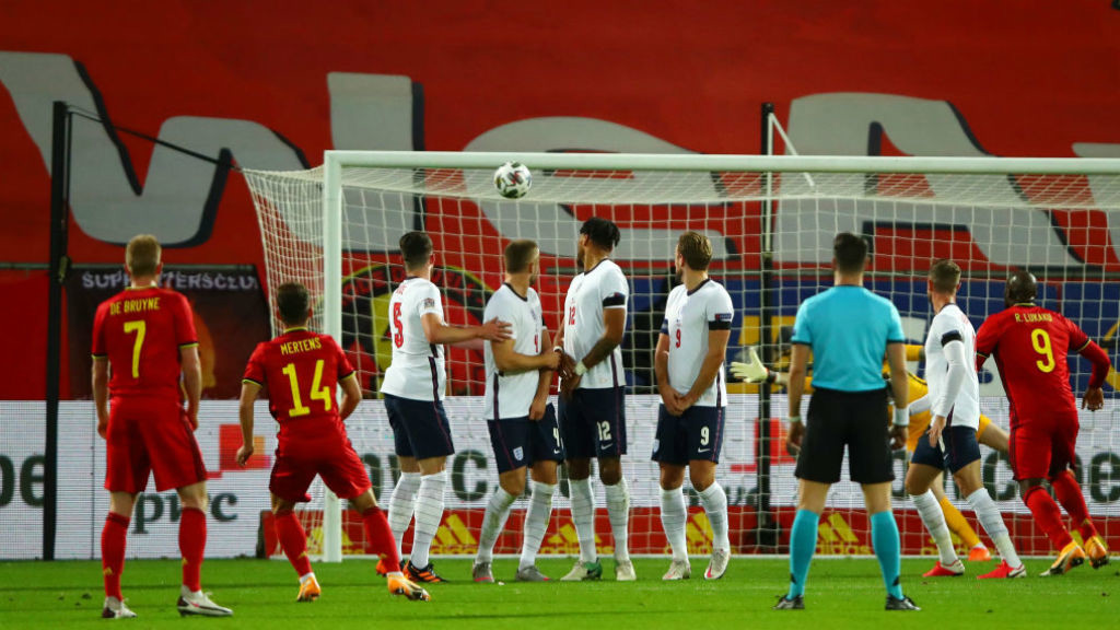 TAKE THAT: Kevin De Bruyne looks on as Dries Mehrtens doubles Belgium's lead against England with a free-kick