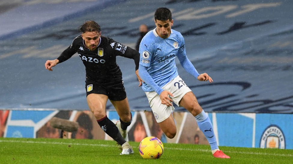 GETTING FORWARD: Joao Cancelo beats Matty Cash down the City left