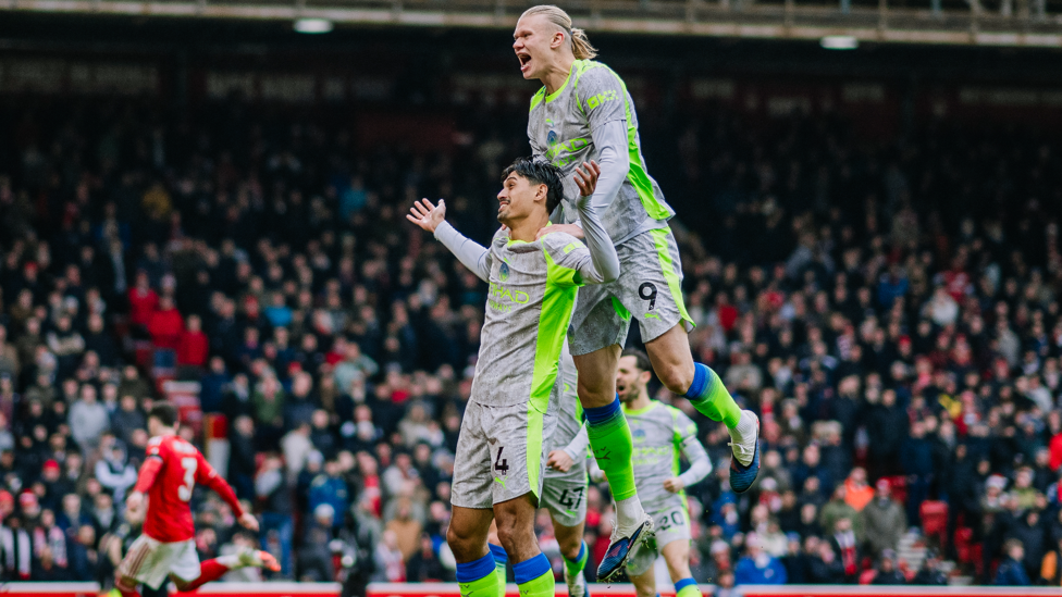 ROAR : Erling celebrates with Reijnders in front of the City fans.
