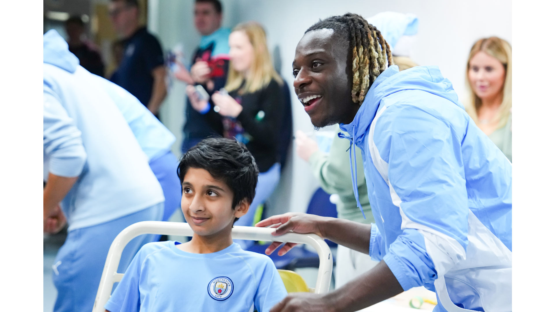 PICTURE PERFECT: Jeremy Doku poses for a picture with a happy young fan.