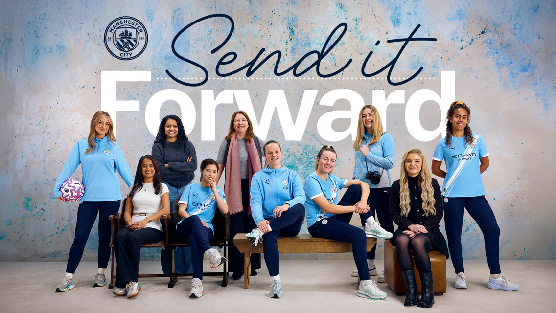 Group of individuals in Manchester City attire in front of 'Send it Forward' text on a speckled blue background.