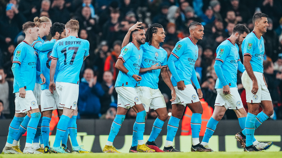MAIN MAN: Mahrez is congratulated by his teammates.