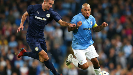 Nigel De Jong takes on Robin Van Persie at Vincent Kompany's testimonial.