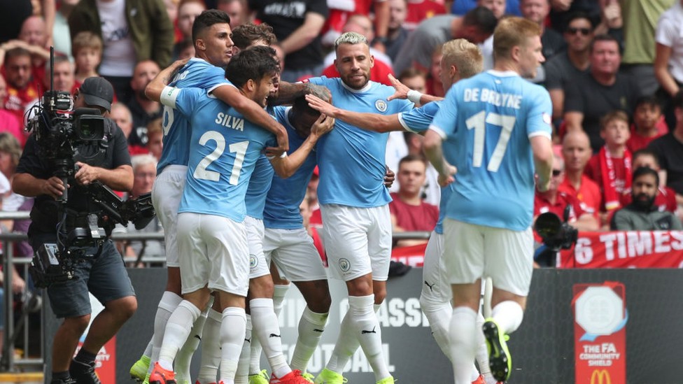 PERFECT START : City's players celebrate Raheem Sterling's opener.