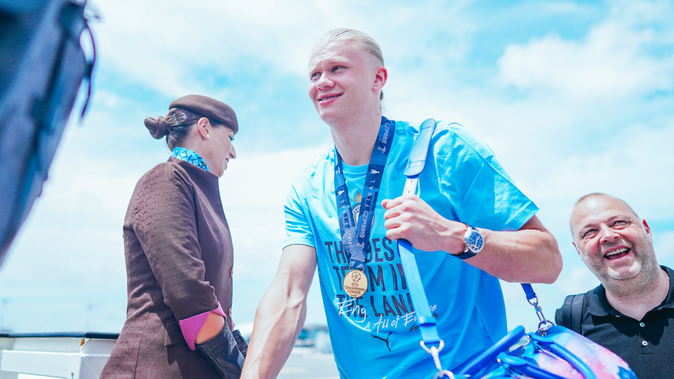 MEDAL OF HONOUR  : Erling Haaland keeps his Champions League winners medal around his neck.