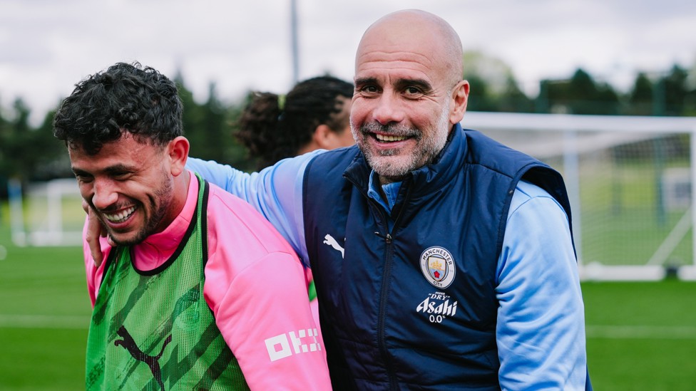 CLOSE UP  : Pep Guardiola and Matheus Nunes in good spirits. 