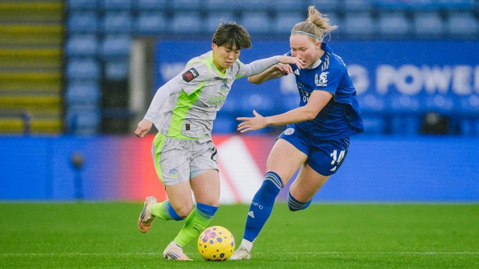 BATTLING HARD: Aoba Fujino fends off tough opposition