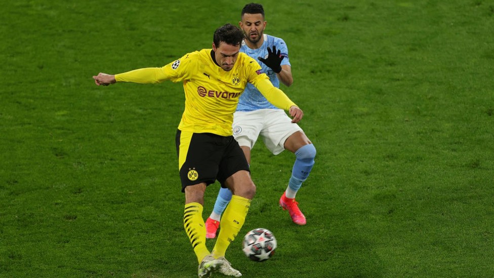 PRESSING HIGH: Riyad Mahrez applies pressure to Mats Hummels