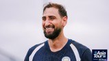 A smiling man in a Manchester City training jersey with 'Asia Tour '26' text in the corner.