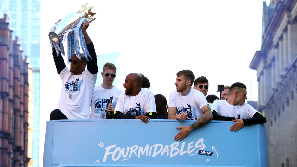 CAPTAIN FANTASTIC : Vincent Kompany hoists the Premier League trophy aloft for the final time in sky blue