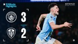 Image showing the Manchester City vs Leeds United match score, with City winning 3-2. A blurred player is celebrating on the right in a light blue kit, with team logos for both clubs displayed.