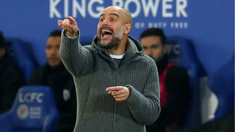FESTIVE POINTER: Pep Guardiola passes on some intructions
