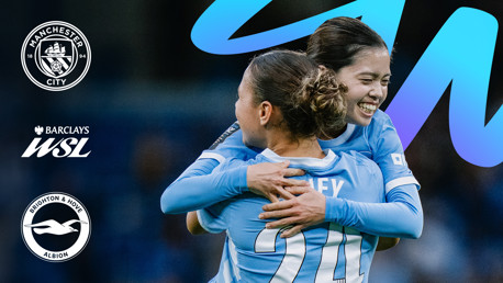Two Manchester City Women's players celebrate during a Barclays WSL match against Brighton & Hove Albion, featuring team logos and WSL branding.
