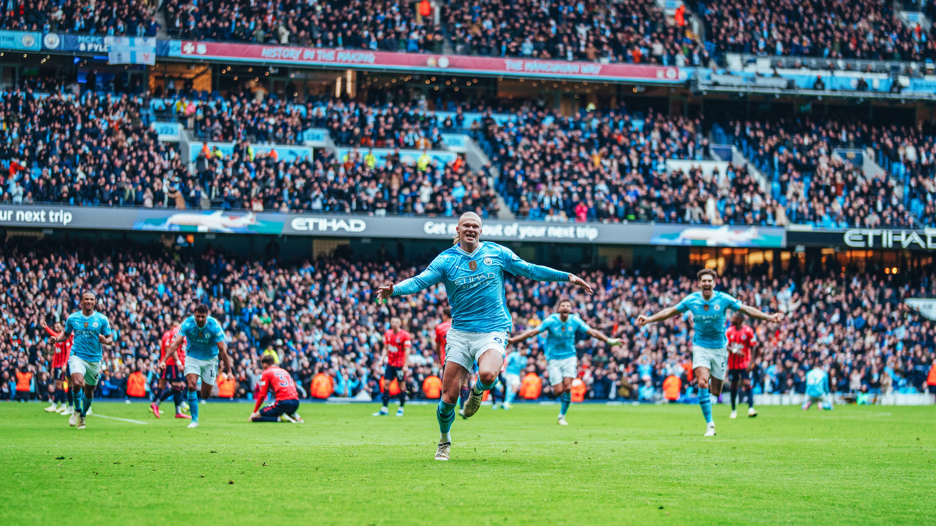 OH YES: Erling gets the celebrations underway.