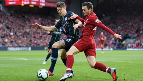 SOLID BLOCK: John Stones puts the squeeze on Andy Robertson