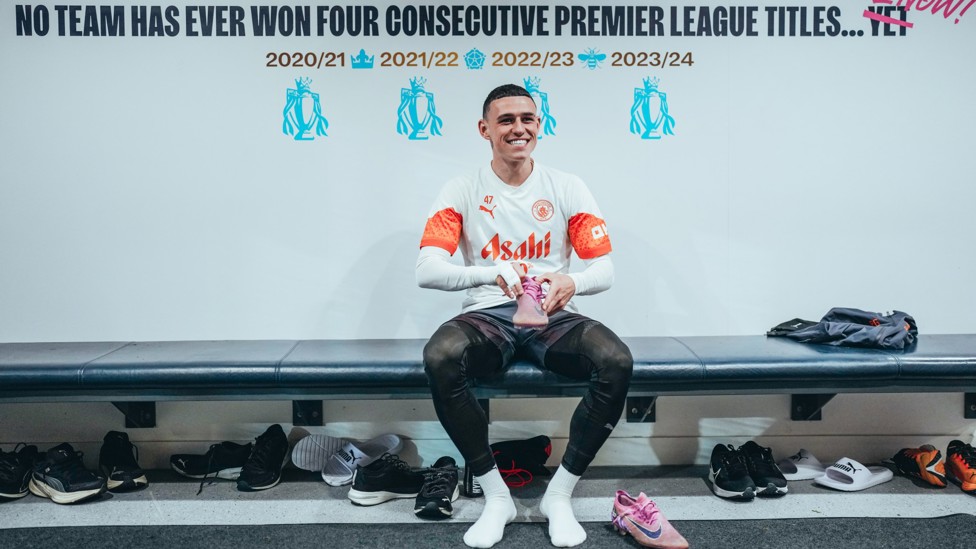 BOOT IT UP : Phil Foden under the new sign in the dressing room