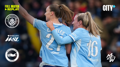 Two Manchester City players celebrate together on the field wearing sky blue jerseys. Text includes 'Full Match Replay' for Manchester City vs Brighton & Hove Albion in the Barclays WSL. City+ branding is visible.