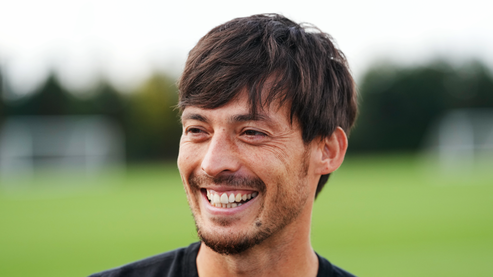 Felicidad : La sonrisa de David en un día lleno de emociones.