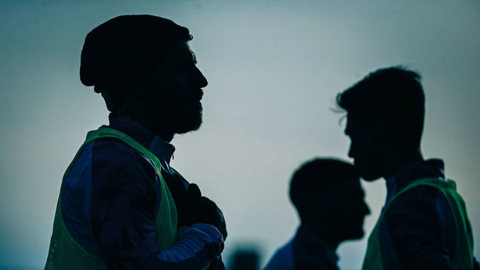MYSTERY MAN : A familiar figure was back out on the training turf...