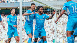 STERLING JOB: Raheem is congratulated by his teammates after his 19th minute goal.