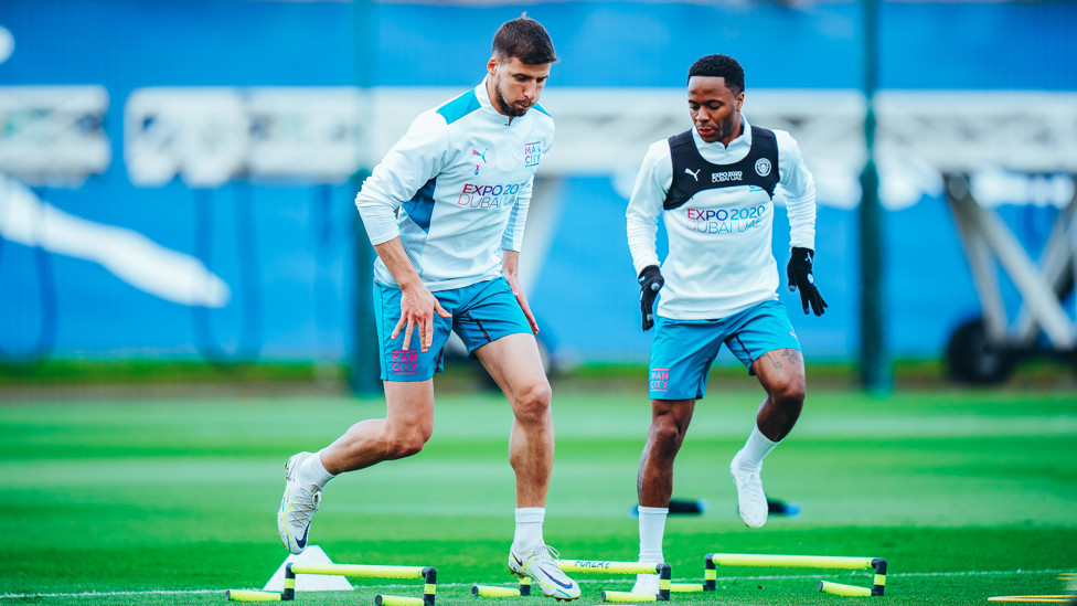 ACTION STATIONS : Ruben Dias and Raheem Sterling work their way over some hurdles