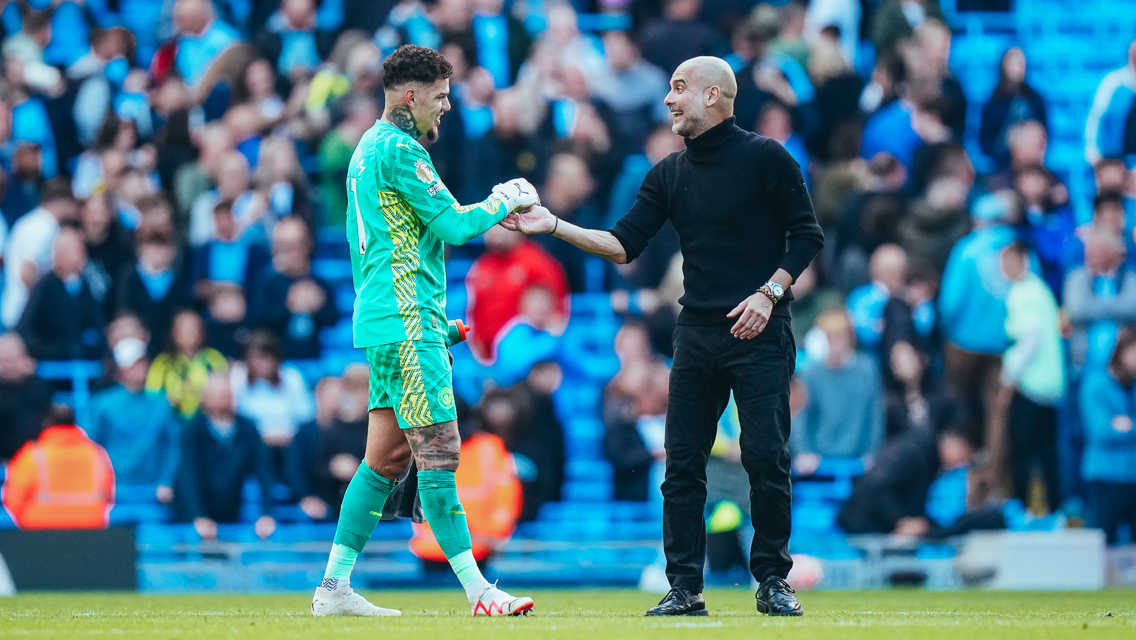 ALL SMILES: The boss shares a joke with Ederson.