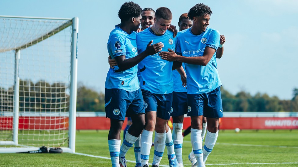 TOGETHER : The team celebrate our third in City's 3-1 in over United. 