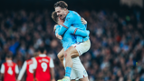 BEAR HUG: Stones feels the love from Grealish!