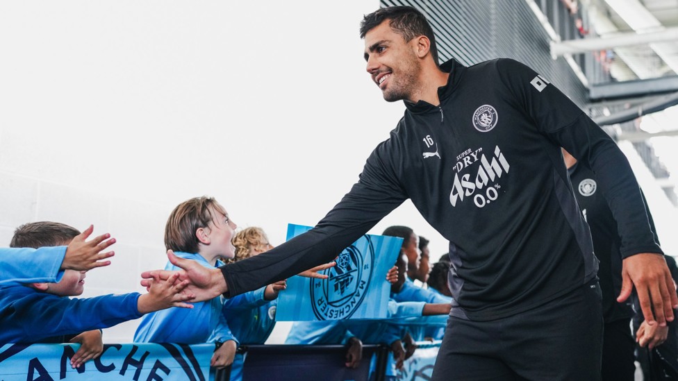 CITY FAITHFUL  : Rodri greets the fans.