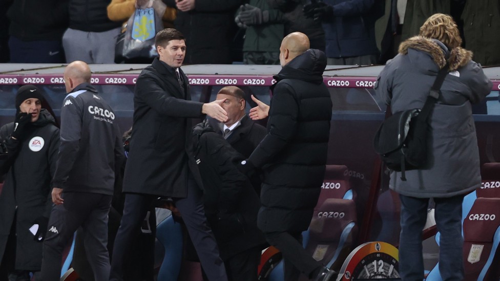 RESPECT : Pep and Steven Gerrard shake hands before we get underway. 