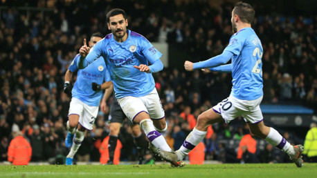 BACK OF THE NET: Gundogan wheels away to celebrate his successful spot kick.