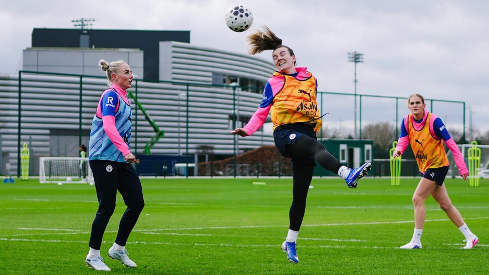 RISING HIGH : Lauren Hemp jumps to get the header in
