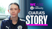 A person with a blurred face wearing Manchester City attire sits indoors. Text on the image reads 'WE ARE City in the Community CIARA'S STORY.'